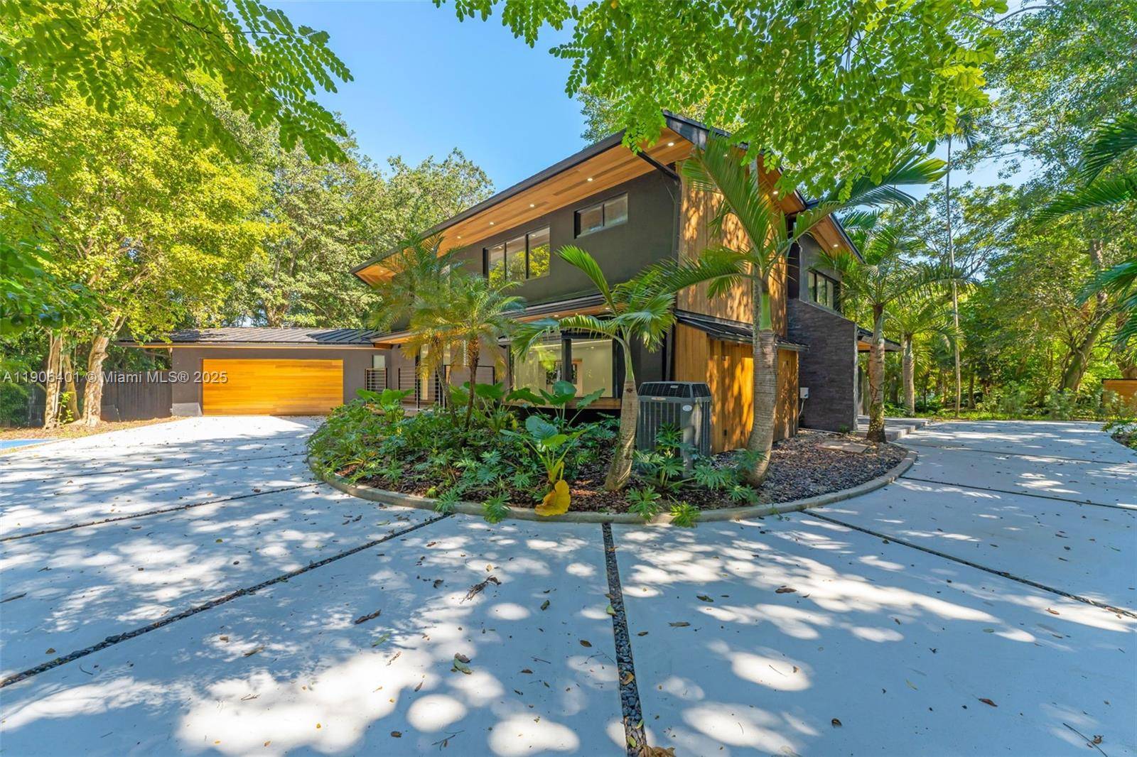 Luxury meets design in this stunning Mid Century Modern home located in Pinecrest s exclusive Devonwood community.