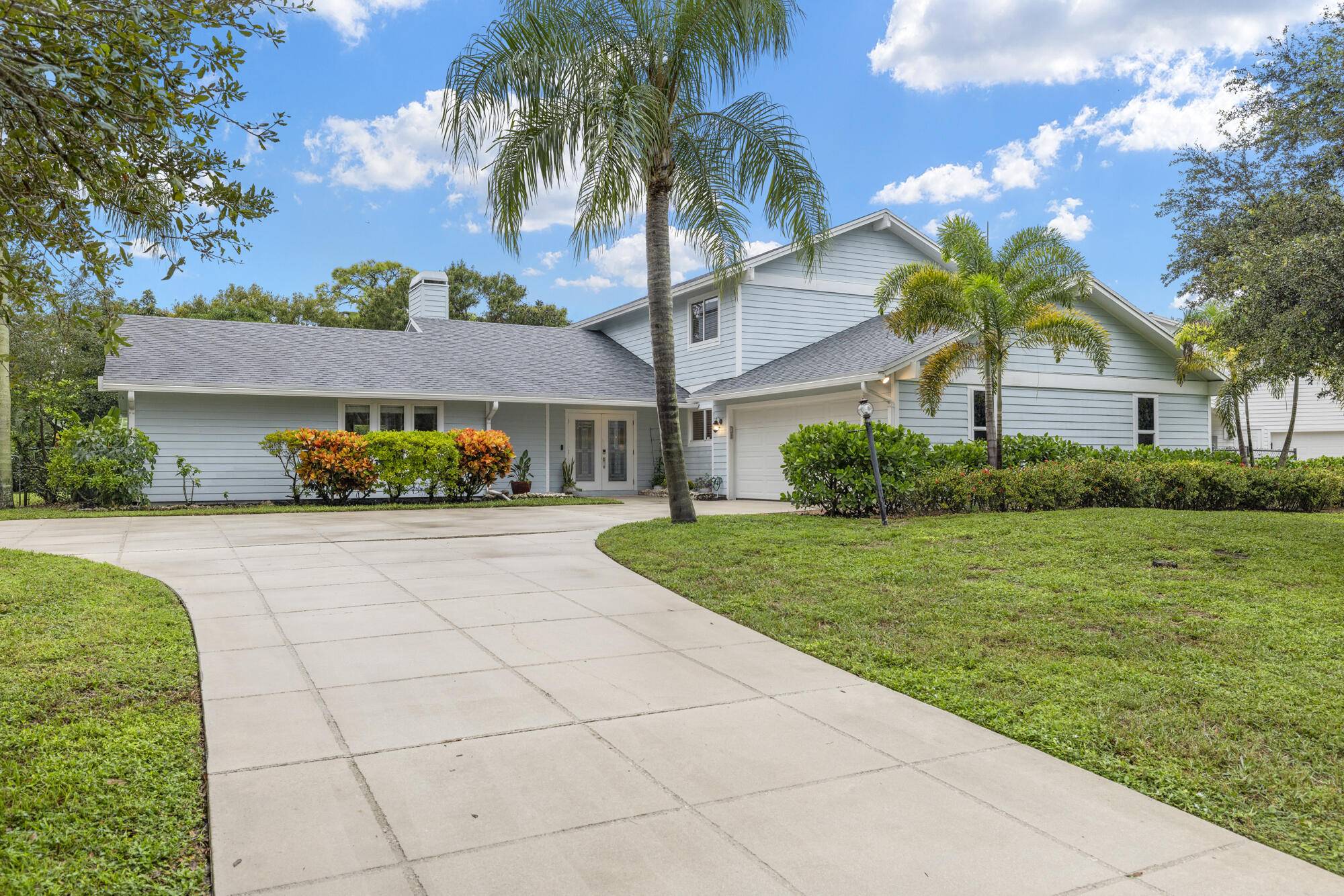 Rare opportunity to own just over half an acre and a CBS home in the highly sought after, Whispering Trails of Jupiter !