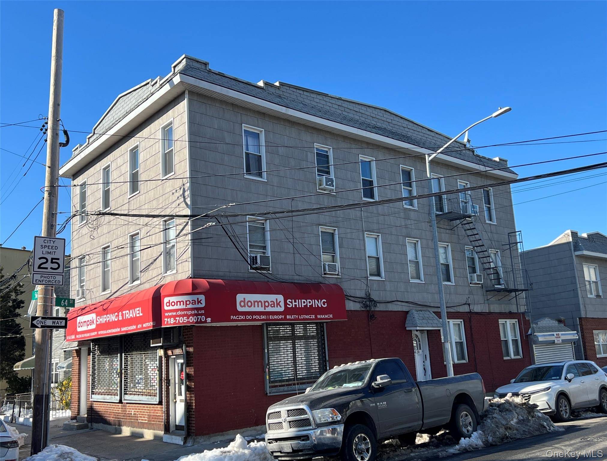 Three Story Mixed Use Building Featuring A Street Level Retail amp ; Five Apartments.