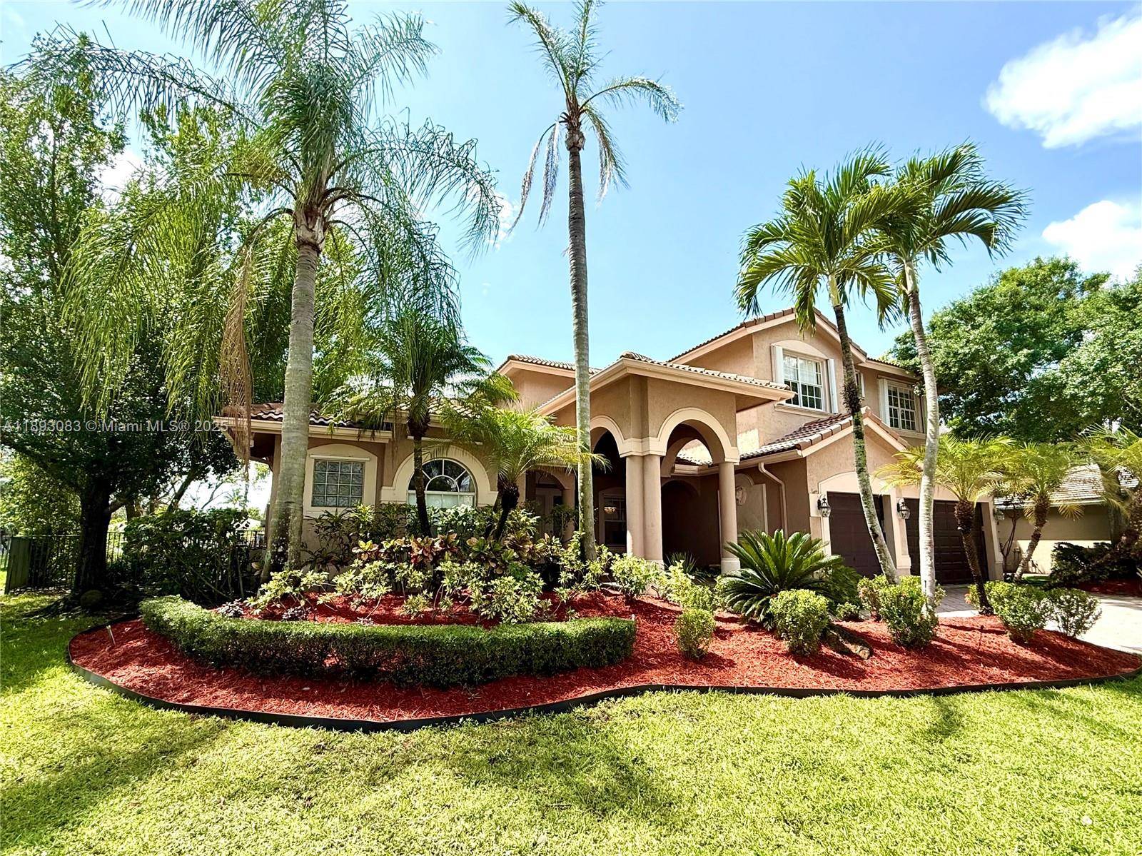 Stunning 5BD 4. 5BA lakefront residence in the prestigious Weston Hills Country Club.
