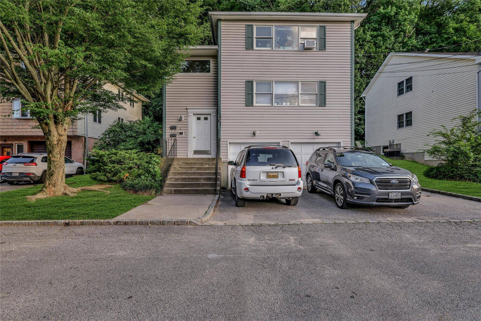 Welcome To 14 Long Branch Road, A Rarely Available Well Maintained Newer Constructed Two Family Home In The Heart Of Glen Cove.