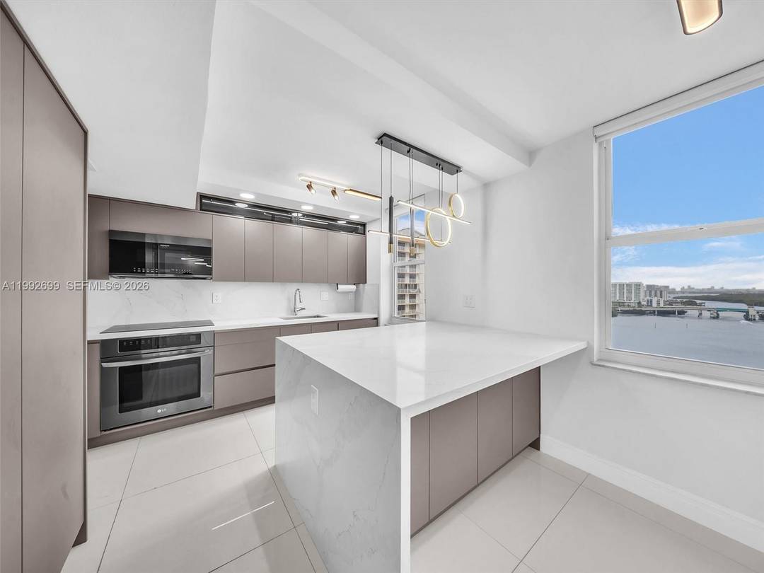 Beautifully upgraded and spacious corner residence in the heart of Sunny Isles Beach with breathtaking Intracoastal and ocean views.