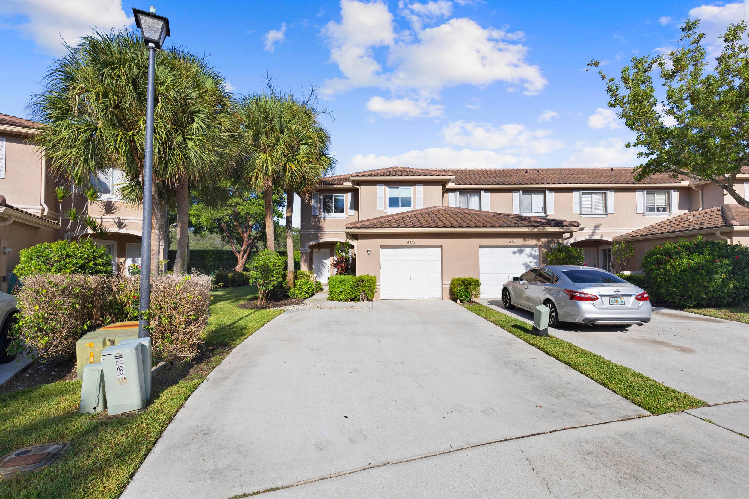 Beautiful end unit with loft private screened in backyard oasis ideal for relaxing or entertaining !