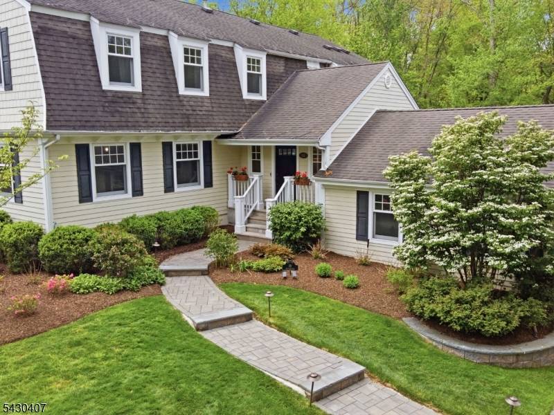 JUS IN TIME FOR SUMMER ! Nestled in Chatham Township's desirable Wickham Woods neighborhood, this exceptional 5 bedroom, 4 full bath home blends timeless cottage inspired charm with a resort ...