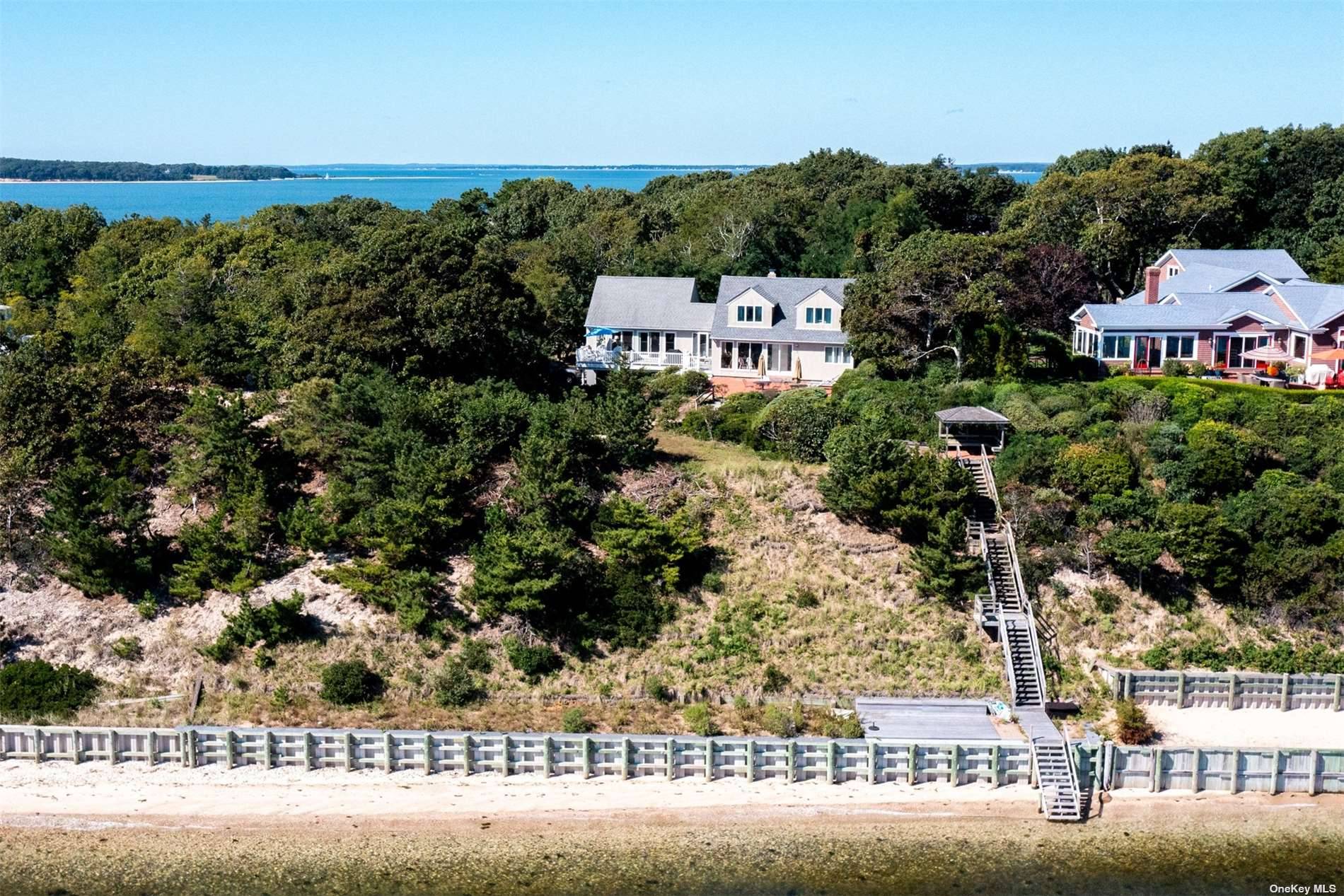 Sunrise and Sunsets. At the end of the Nassau Point Penninsula high up in the trees surrounded by water sit this lovely private beach house with forever views across Little ...