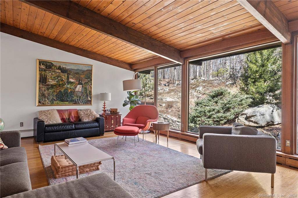 This 4 bedroom, 3. 5 bath Mid Century deck house, set on a private acre, beautifully blends retro charm with modern style.