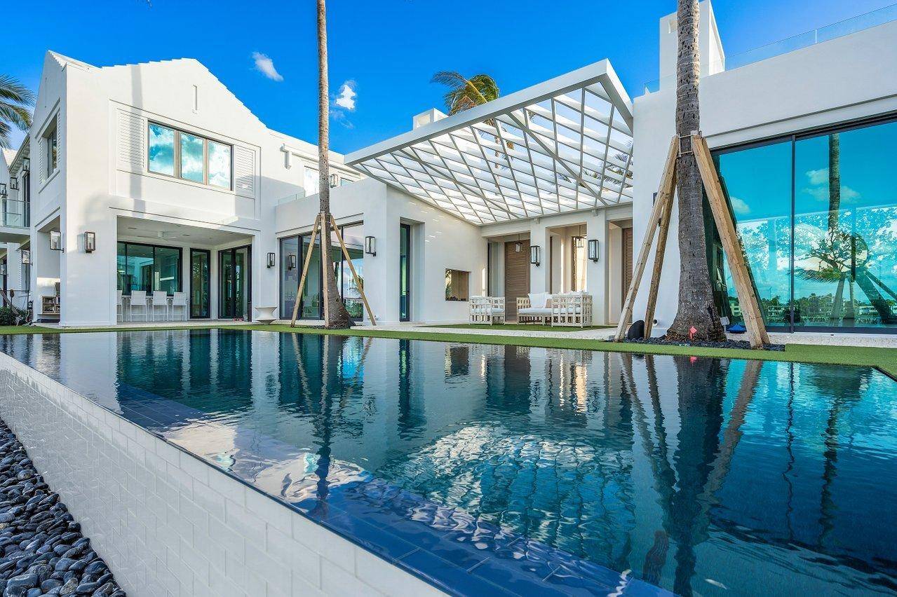 Direct oceanfront estate offering the most unique South Florida indoor outdoor living experience that is truly unrivaled.