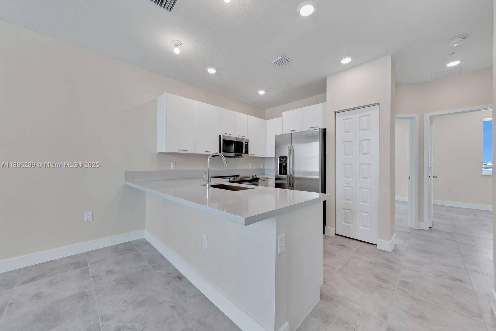 This modern and spacious 3 bedroom 2 bathroom condo is located in the beautiful community of Landmark at Doral.