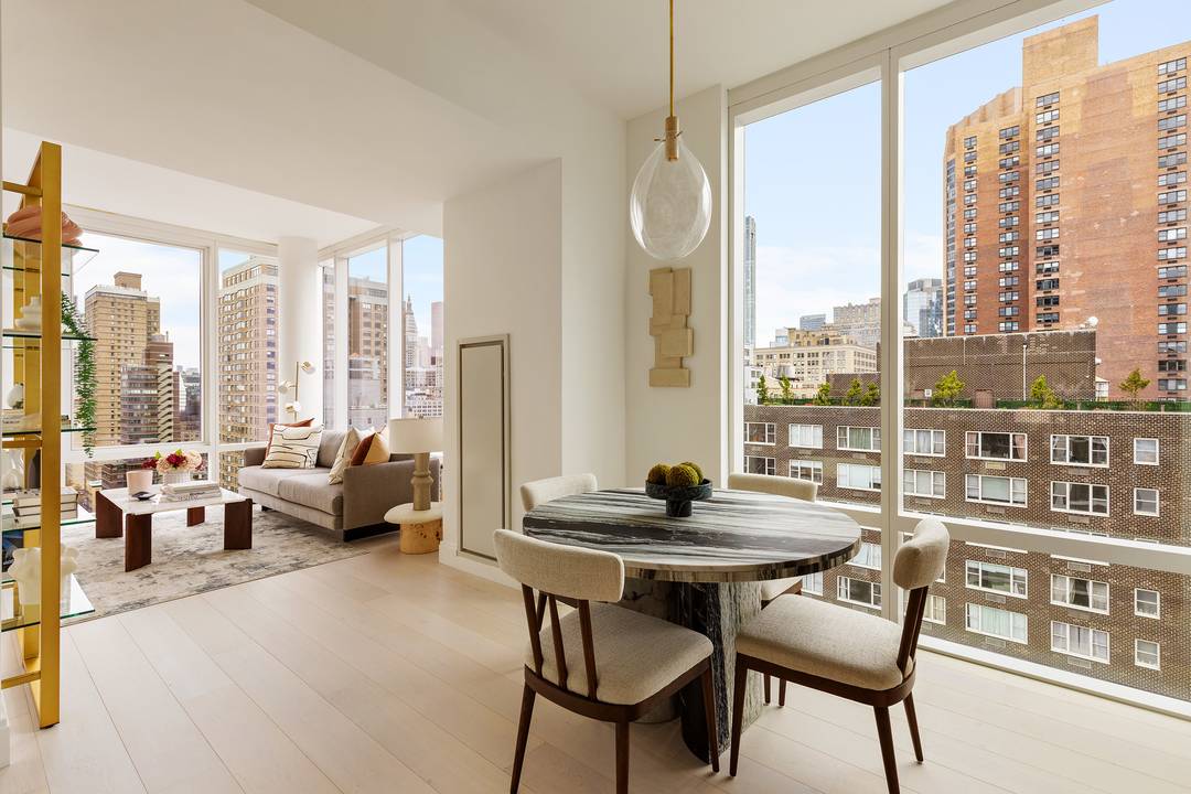 Luxury corner one bedroom home with 10' floor to ceiling windows, and expansive Southern and Manhattan Skyline views.