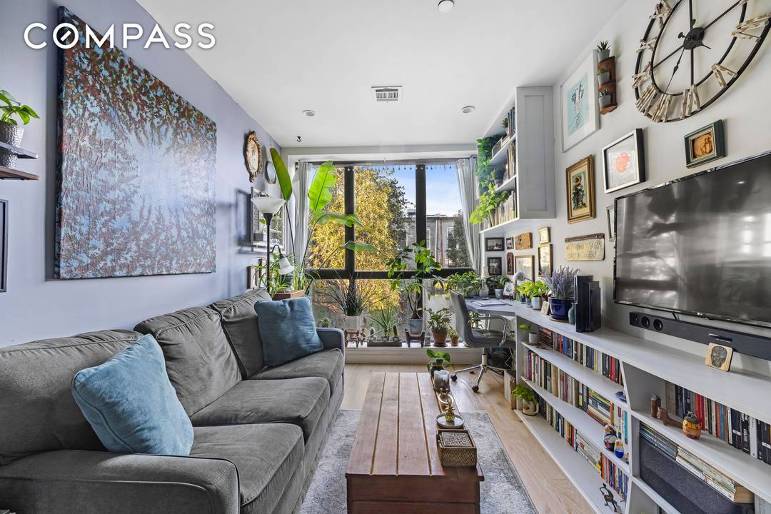 This bright and spacious condo features high ceilings, central A C, a Nest thermostat, and the convenience of an in unit washer dryer.