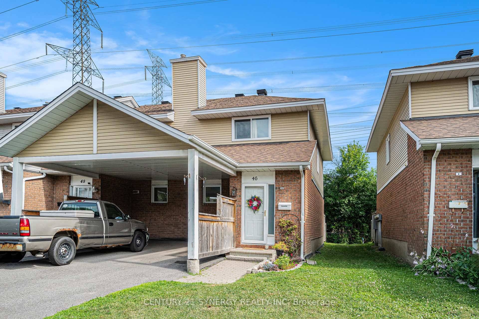 Welcome to your new stunning end unit condo townhouse with convenient carport and no rear neighbours !