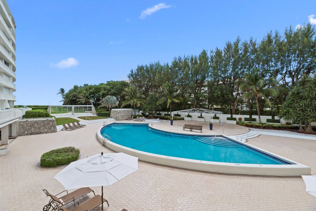 Unique opportunity to purchase and renovate corner residence located at Ambassador II, showcasing panoramic views of both the Atlantic Ocean and Intracoastal Waterway.