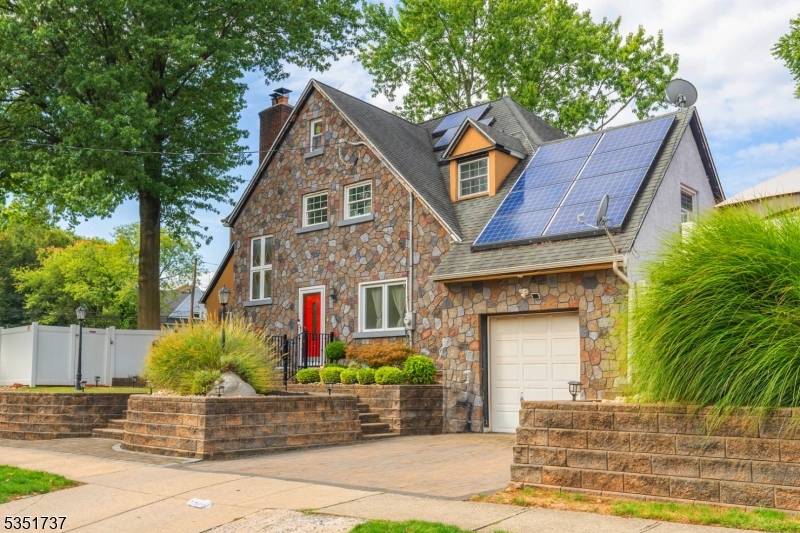 Welcome to a stunning Tudor Colonial that blends timeless character with exceptional indoor outdoor living.