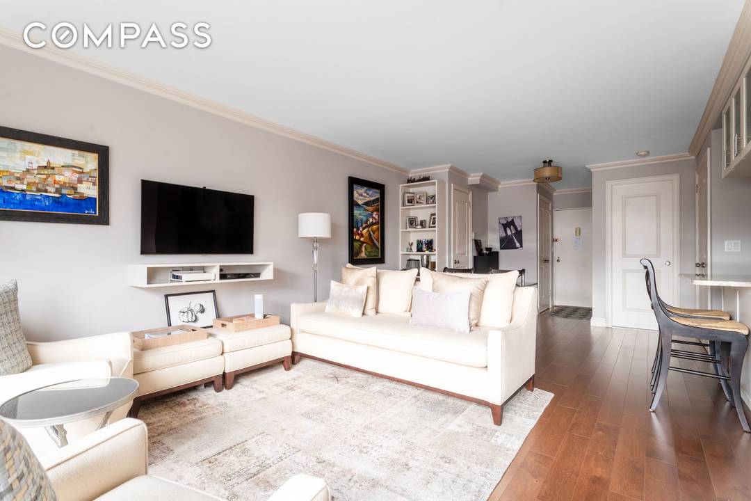 Apartment 12H Renovated Alcove Studio with Open Island Kitchen, Custom Closets amp ; Expansive Skyline Views Perched high above the Upper East Side in a full service cooperative, this beautifully ...