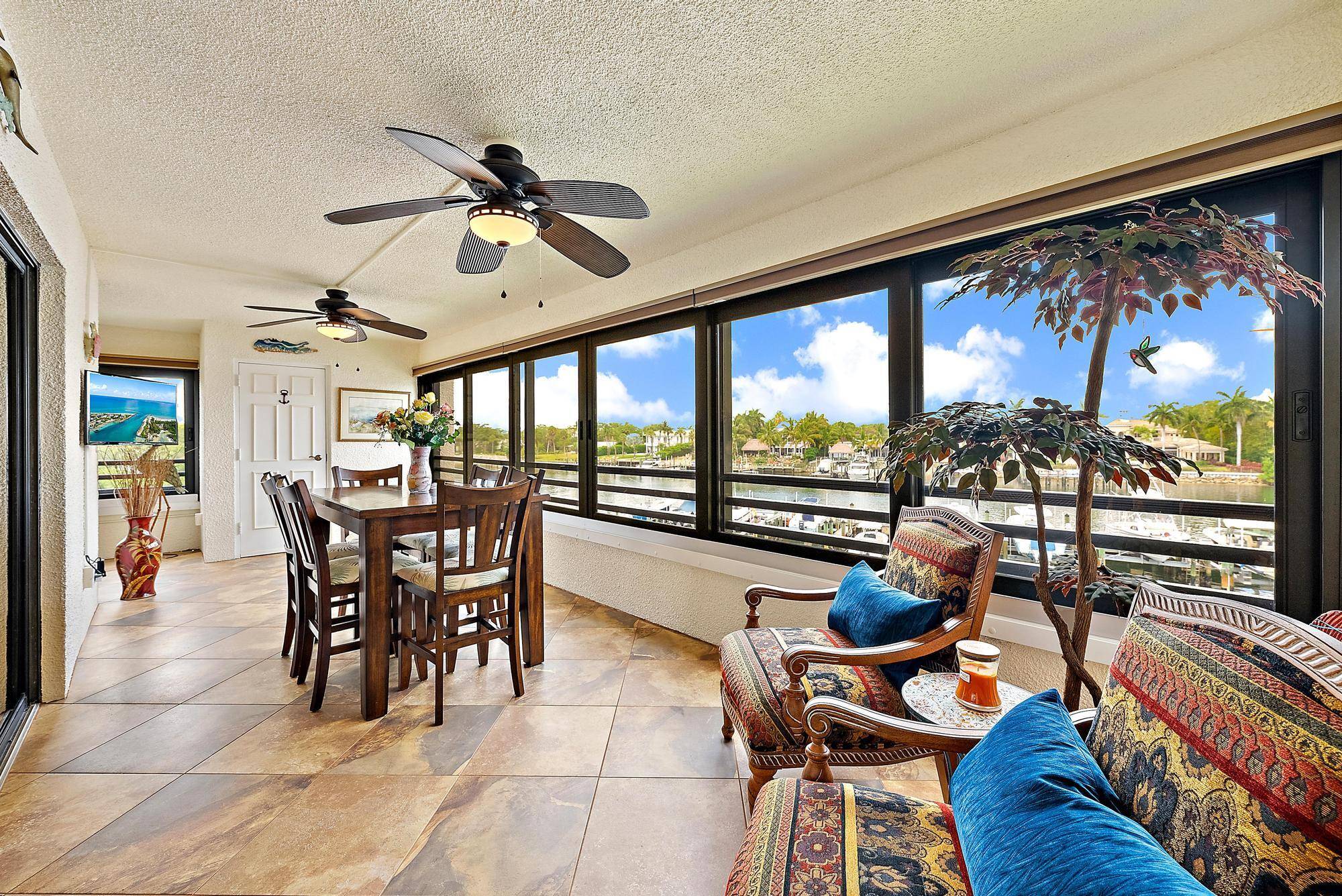 Come watch the boats glide by from this stunning intracoastal front 2 BR, 2 1 2 BA condo.
