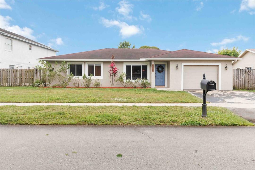 Welcome to this beautifully updated home nestled in a charming west Sunrise neighborhood with NO HOA !