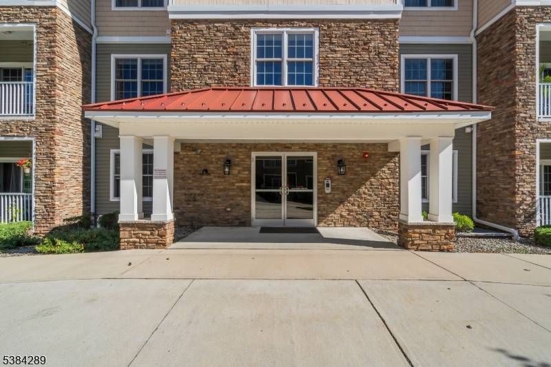 Experience refined living in this exceptional first floor condo, where modern elegance meets timeless design.