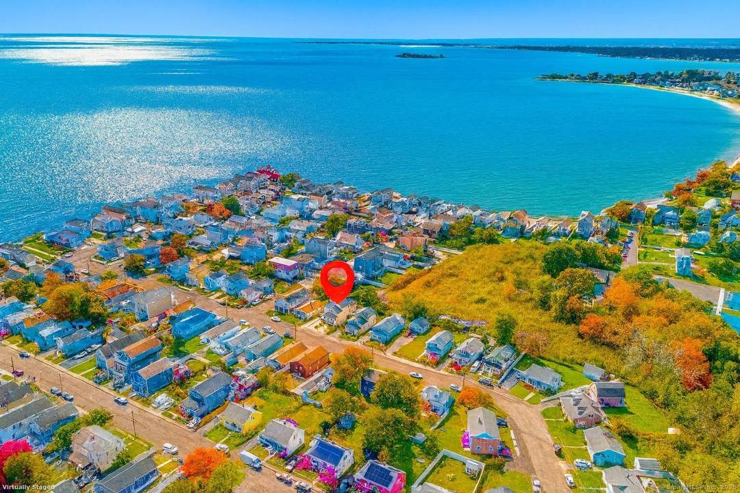 A home that redefines coastal living in Milford's coveted Point Beach enclave.