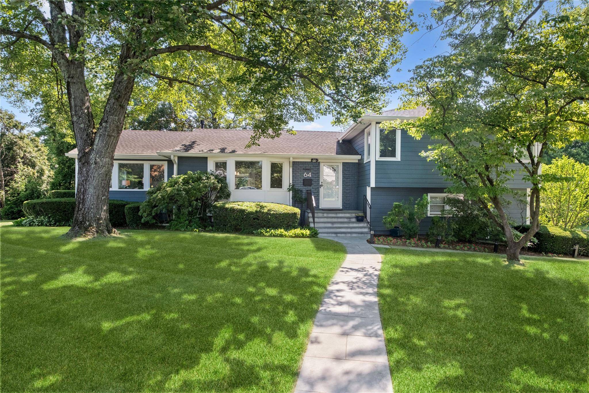 Open the front door to this striking home and sing, Let the sun shine in !