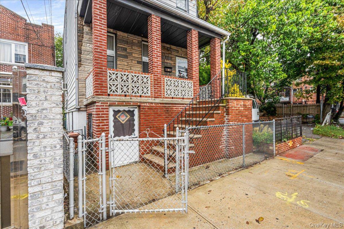 Charming 2 Family home in the heart of Corona featuring 3 levels with HUGE POTENTIAL.