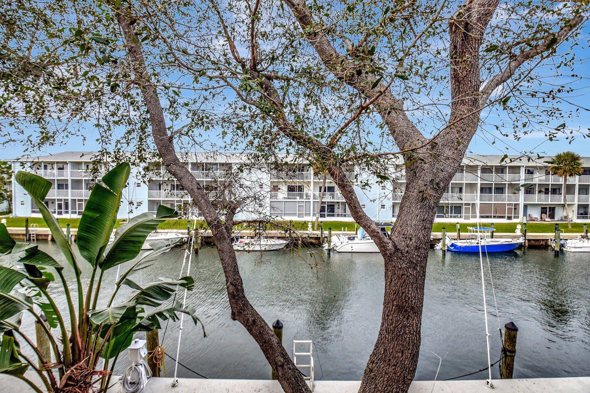 WOW ! Updated 2 2 waterfront condo with a Deep Water deeded 30' boat slip and No Fixed Bridges.