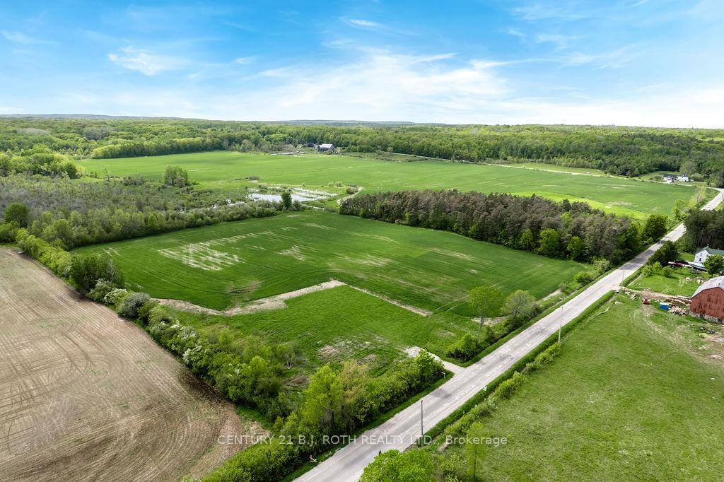 Welcome to one of four fully cleared, level estate lots offering 2 acres of prime land at the corner of Curry and Tay Point Road.