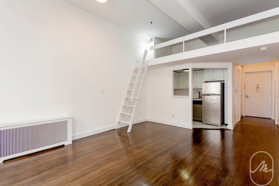 Amazing views, high ceilings, balcony, and storage loft in this gorgeous lofty studio !