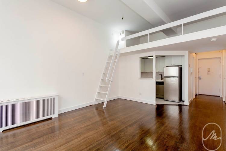 Amazing views, high ceilings, balcony, and storage loft in this gorgeous lofty studio !
