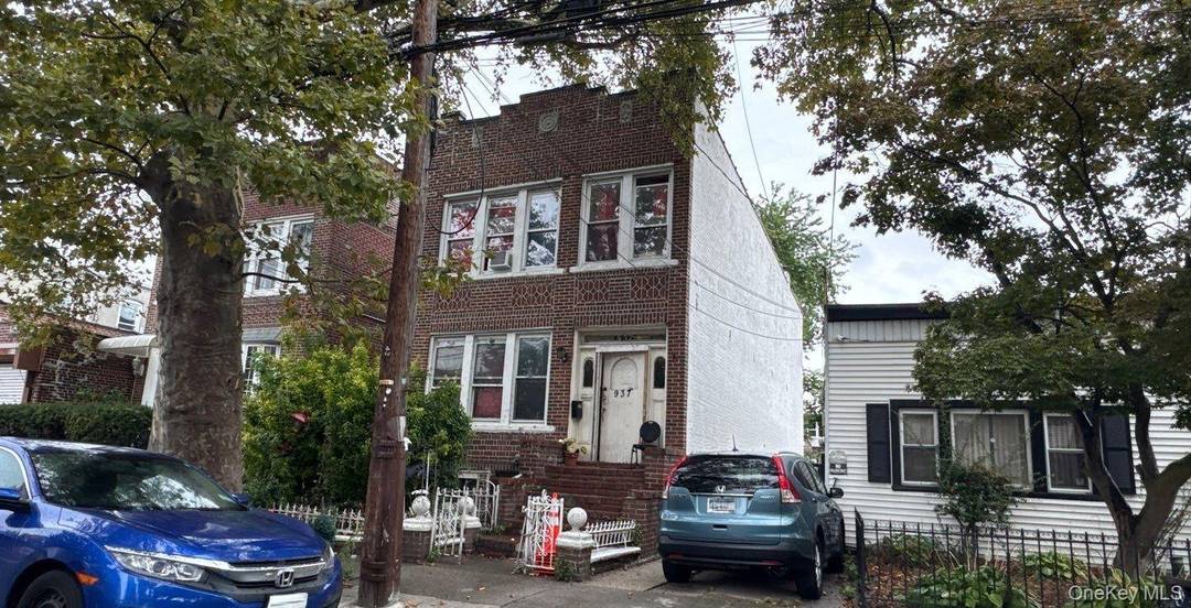 This Colonial Style 2 Family Home Features 6 Bedrooms, 3 Full Baths and Eat In Kitchen.