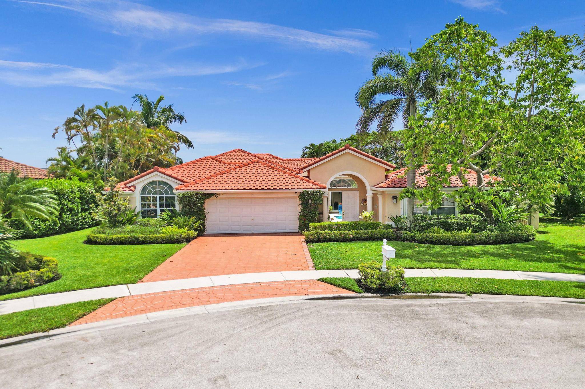 Discover this exceptional Boca Raton lakefront home in the gated community of Boca Isles North.