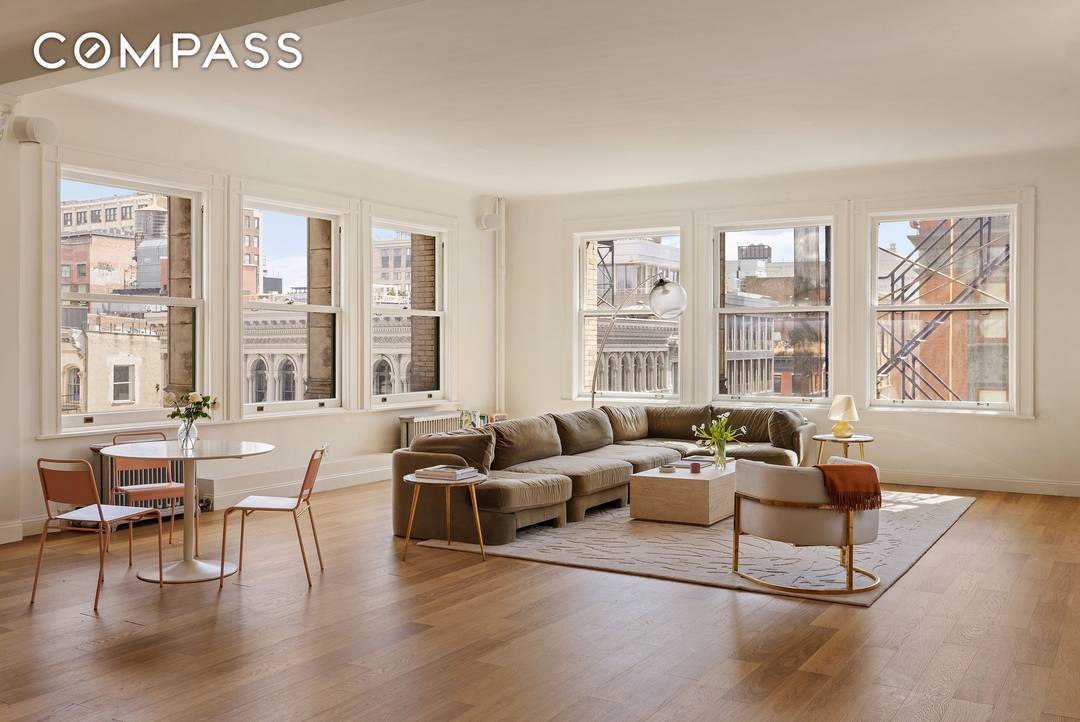 Perched on a high floor, soaring above height restricted SOHO, this authentic 88 foot long loft boasts incredible light and spectacular, open views in multiple directions.