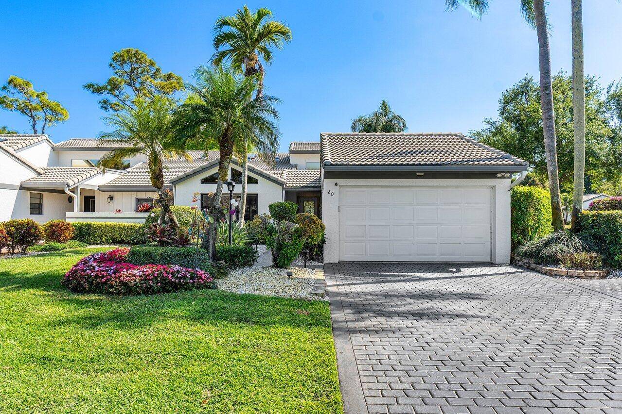 Beautifully remodeled custom villa, situated on a desirable corner lot in Cambridge II at Hunters Run Country Club.