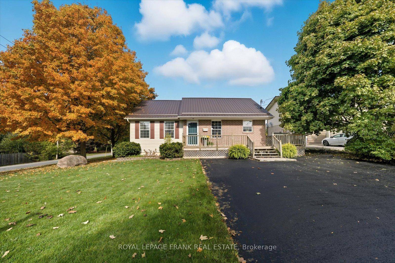 This bright and airy updated home features new flooring and has been freshly painted throughout.