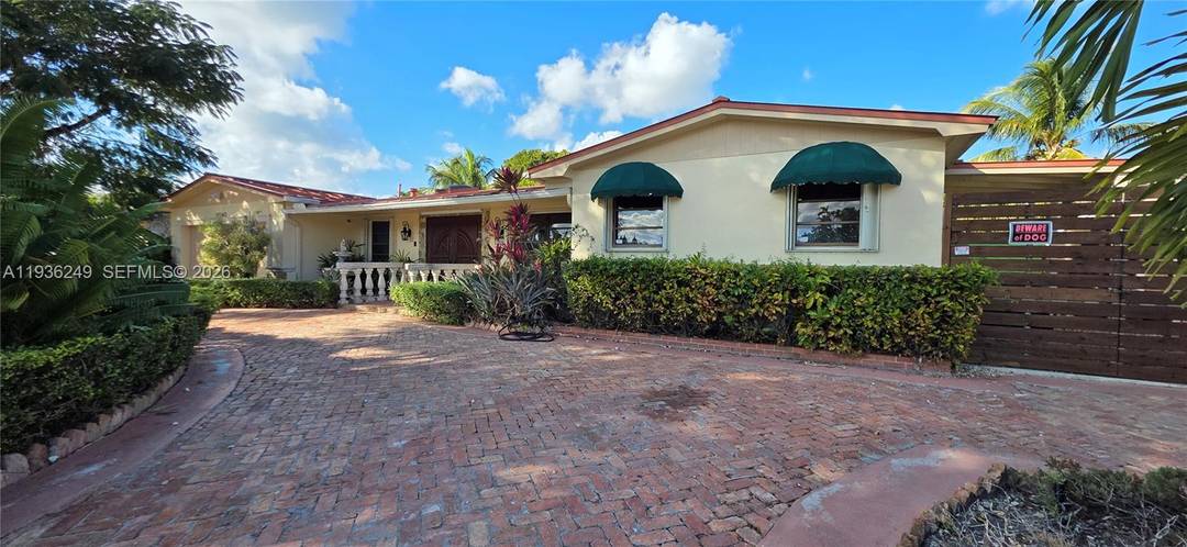 Welcome to this beautifully maintained 1974 waterfront home located in the highly desirable and quiet community of Kendale Lakes.