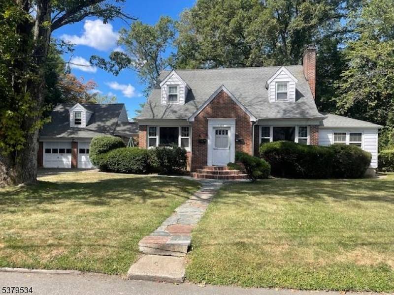 Custom 2 family in top location, large level lot, private patio in rear yard with out building and stone BBQ, maintenance free exterior.