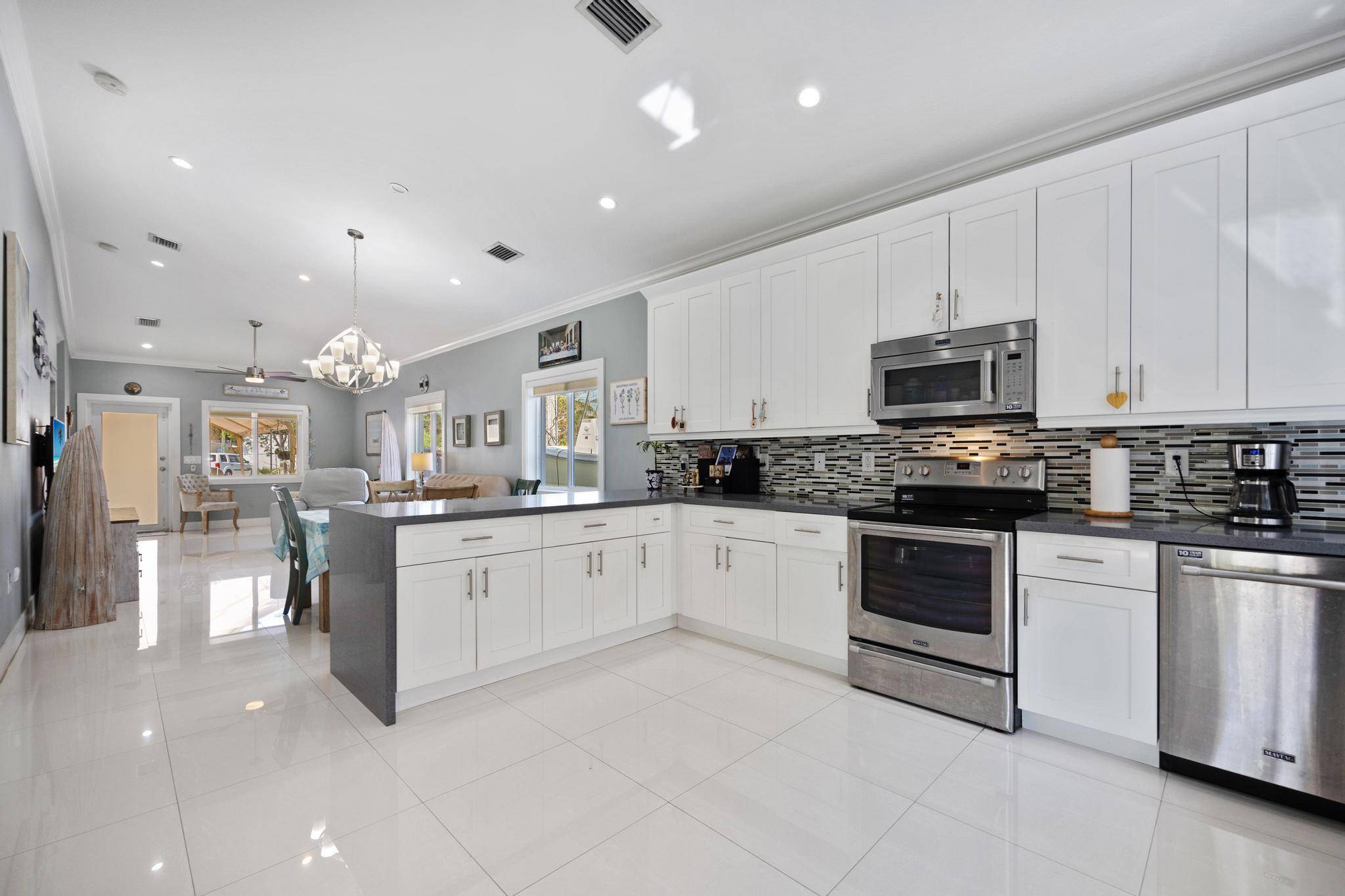 This beautifully maintained 3 bedroom, 2 bathroom CBS home in Key Largo offers luxury, comfort, and convenience.