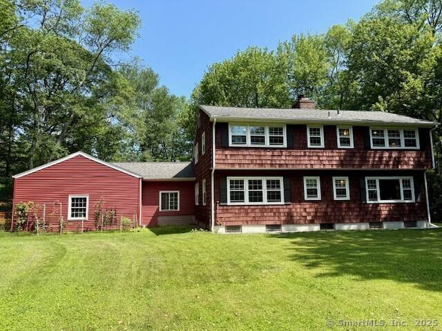 Charming Colonial nestled on a beautiful corner lot in sought after Woodbridge.