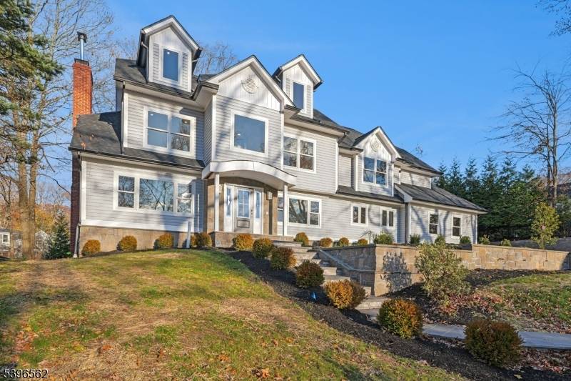 This thoughtfully designed rebuilt home offers a rare combination of modern style, spacious living everyday convenience in one of Summit's most desirable neighborhoods.