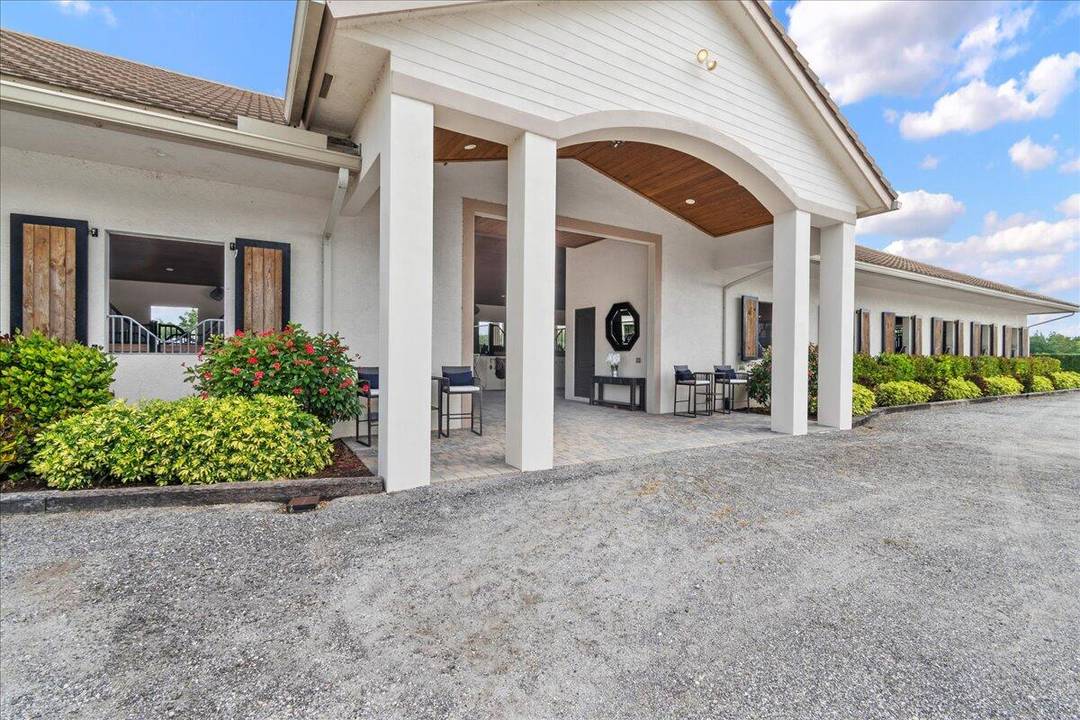 Located just a short drive to Wellington's horse showgrounds, this luxurious barn, built in 2017, is in impeccable condition.