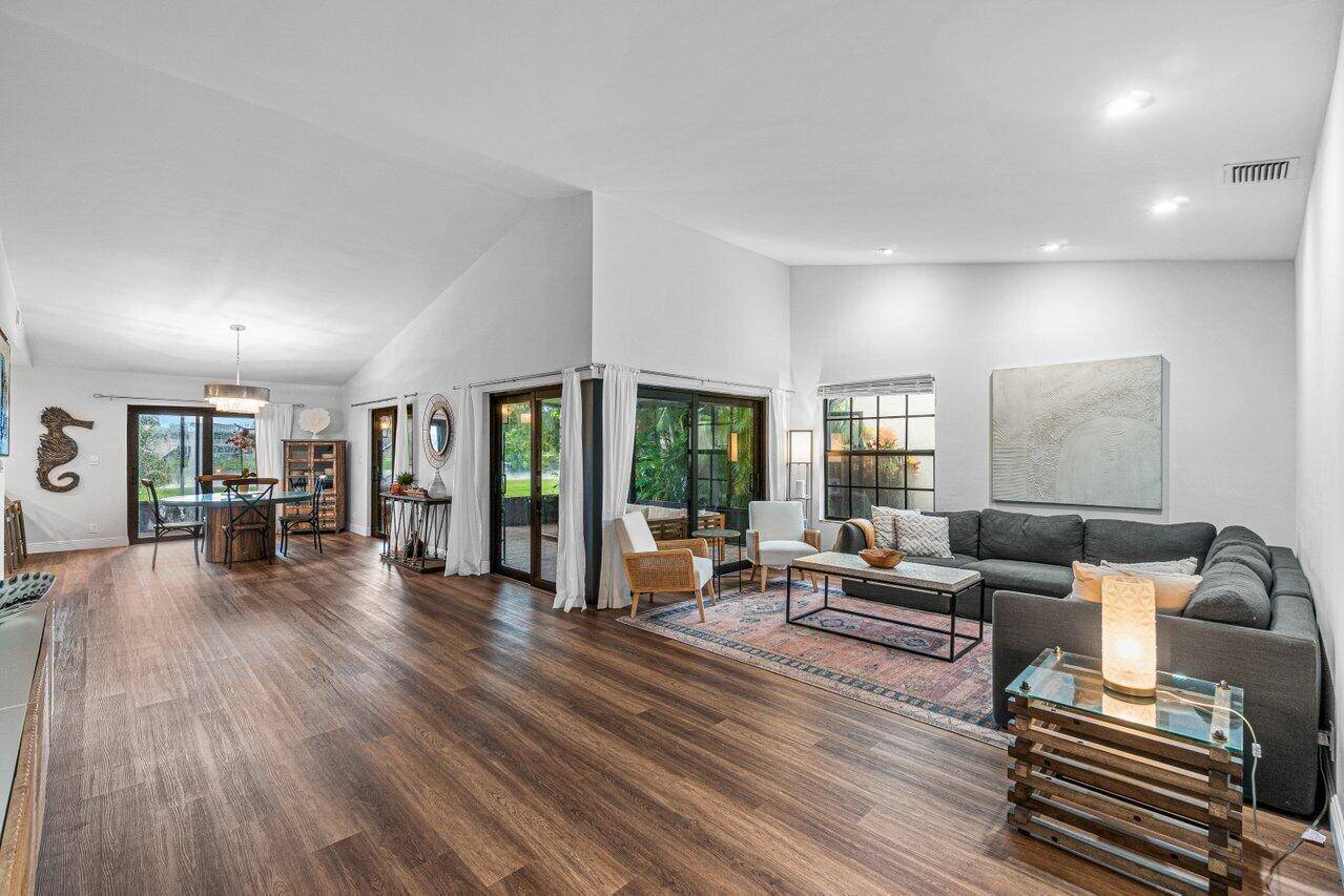 Beautifully remodeled home with stunning lakefront views in desirable gated community, Rainberry Lake !