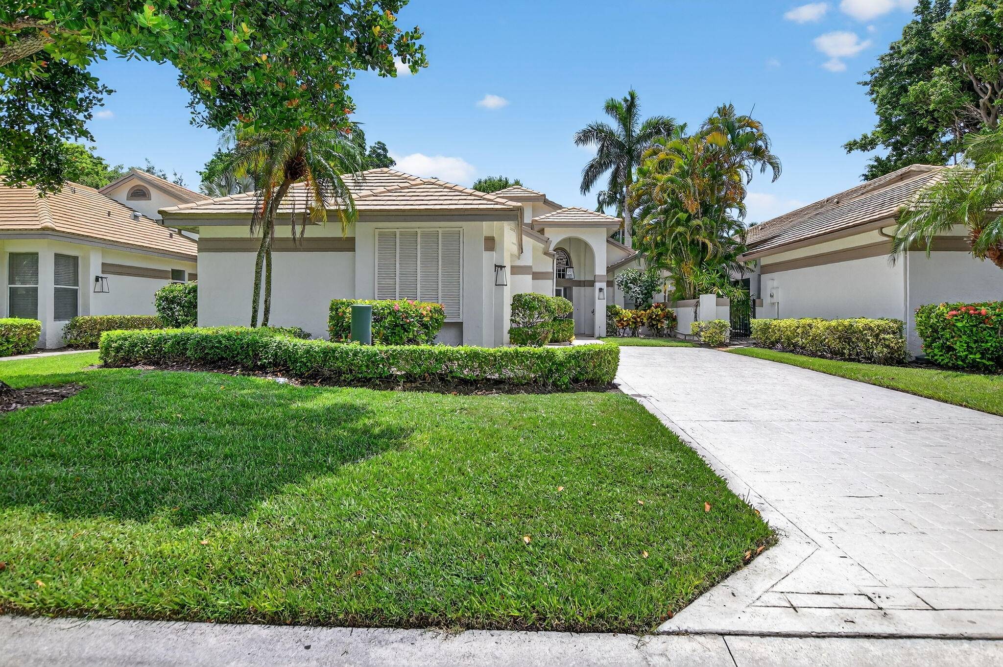 Welcome to this stunning one story single family home located in the desirable Village of Whisper Trace within the prestigious Broken Sound Country Club.