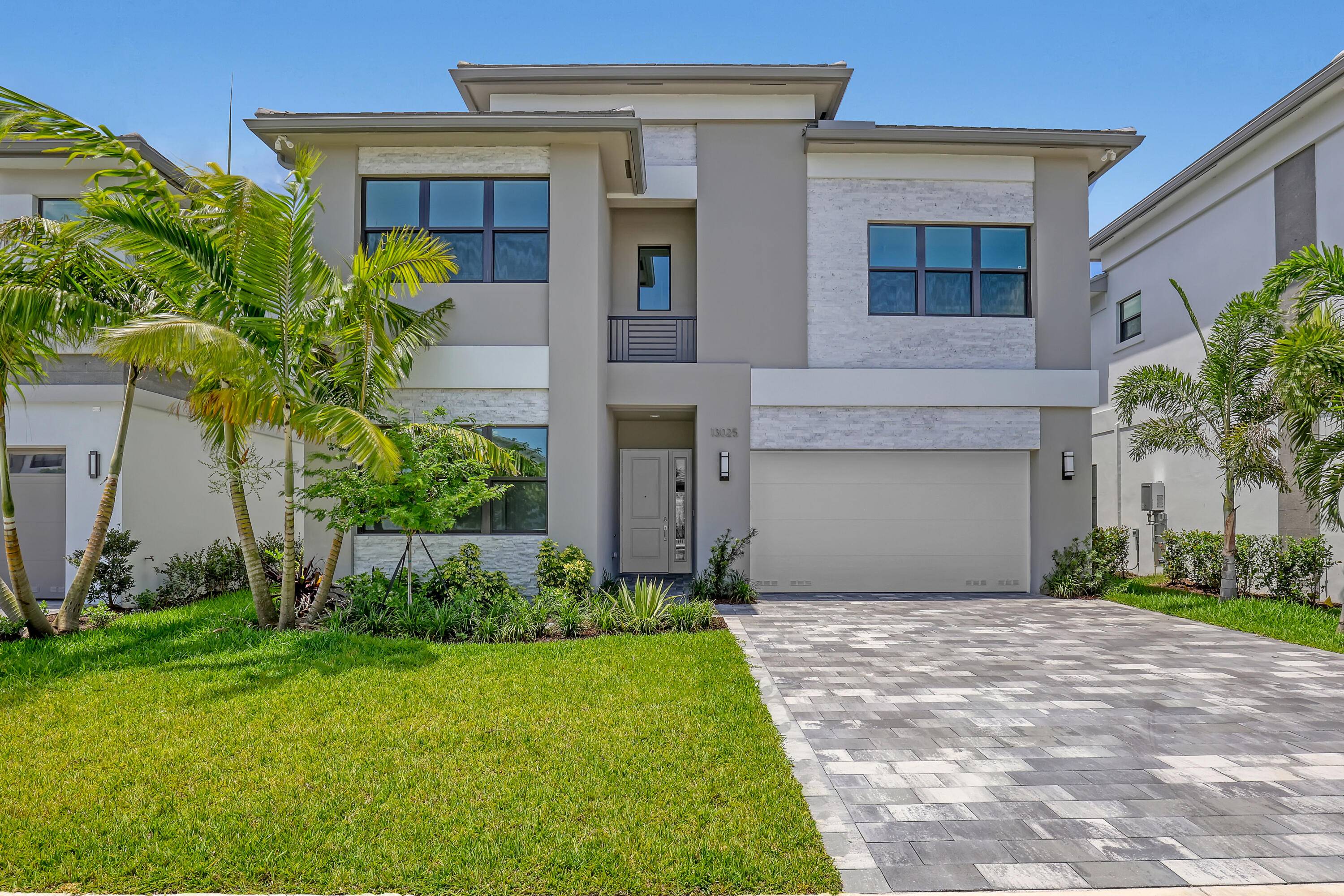 Experience luxury living in this stunning 5 bedroom, 7 bathroom new construction home in the prestigious, gated community of Avenir in Palm Beach Gardens !