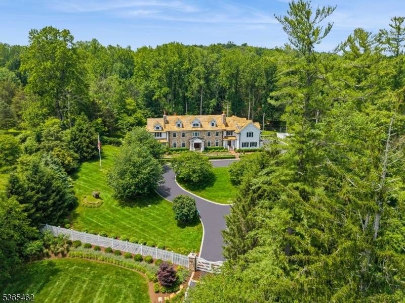 This stunning renovated Mendham estate is a unique property situated on 5.
