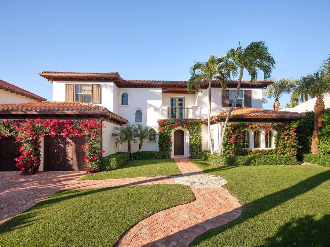 Beautifully reimagined and thoughtfully designed, this exceptional residence is perfectly positioned on one of the premier lake blocks in West Palm Beach's coveted SoSo neighborhood.