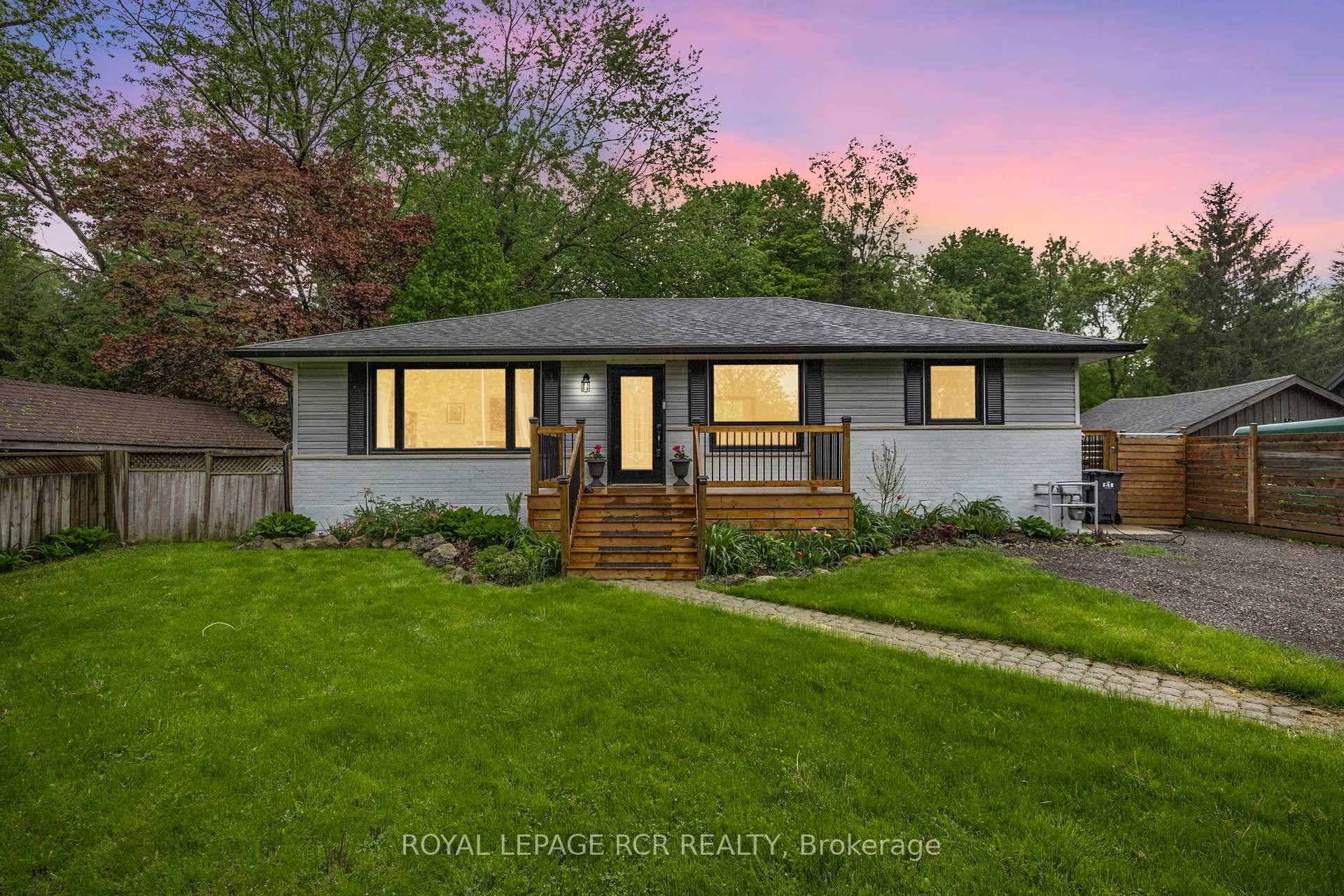 Modern renovated country bungalow on a private lot surrounded by nature and mature trees.
