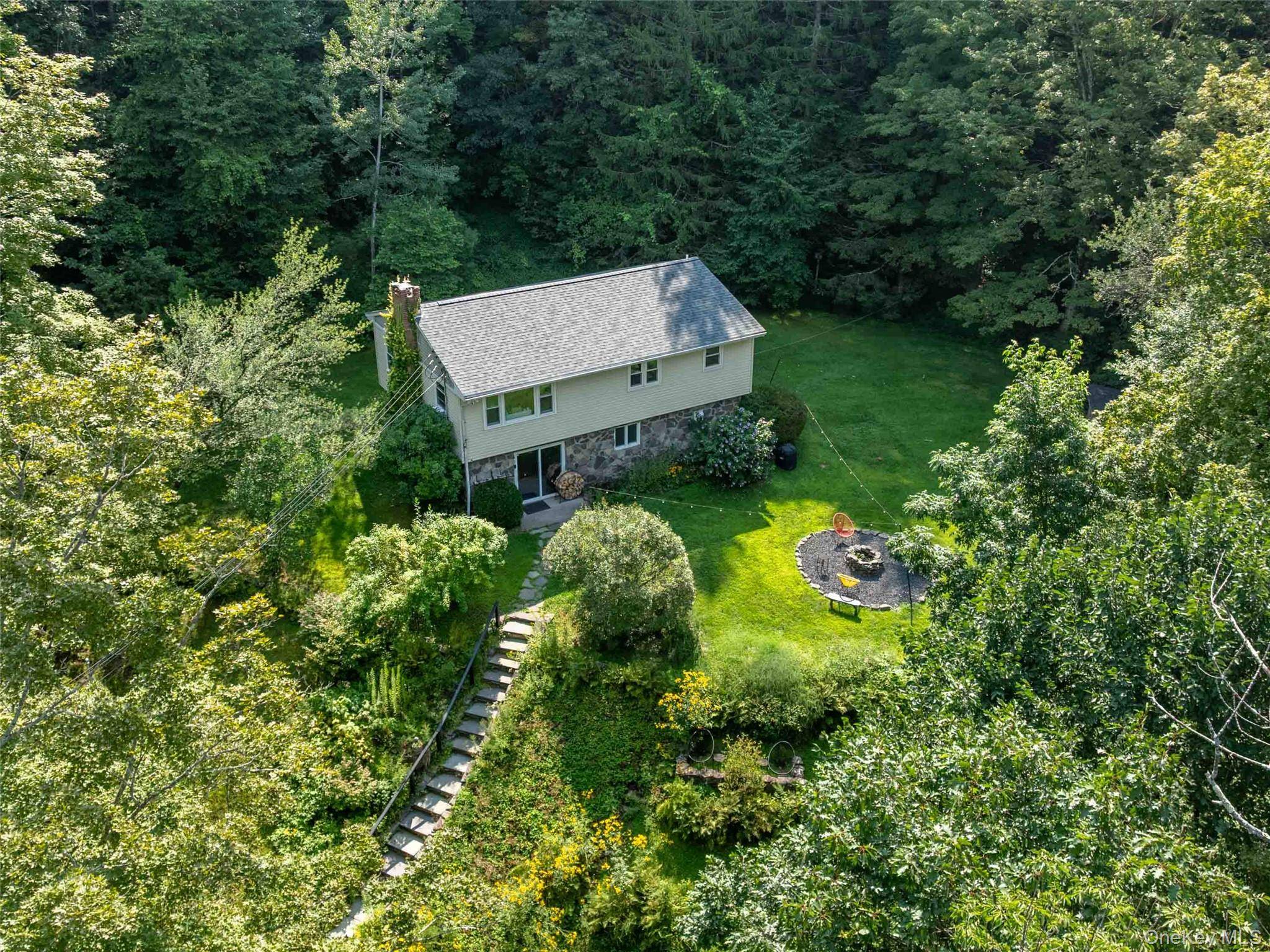 Private Split Level on 3 Acres Tucked away in a quiet, wooded setting, this 3 bedroom, 2.