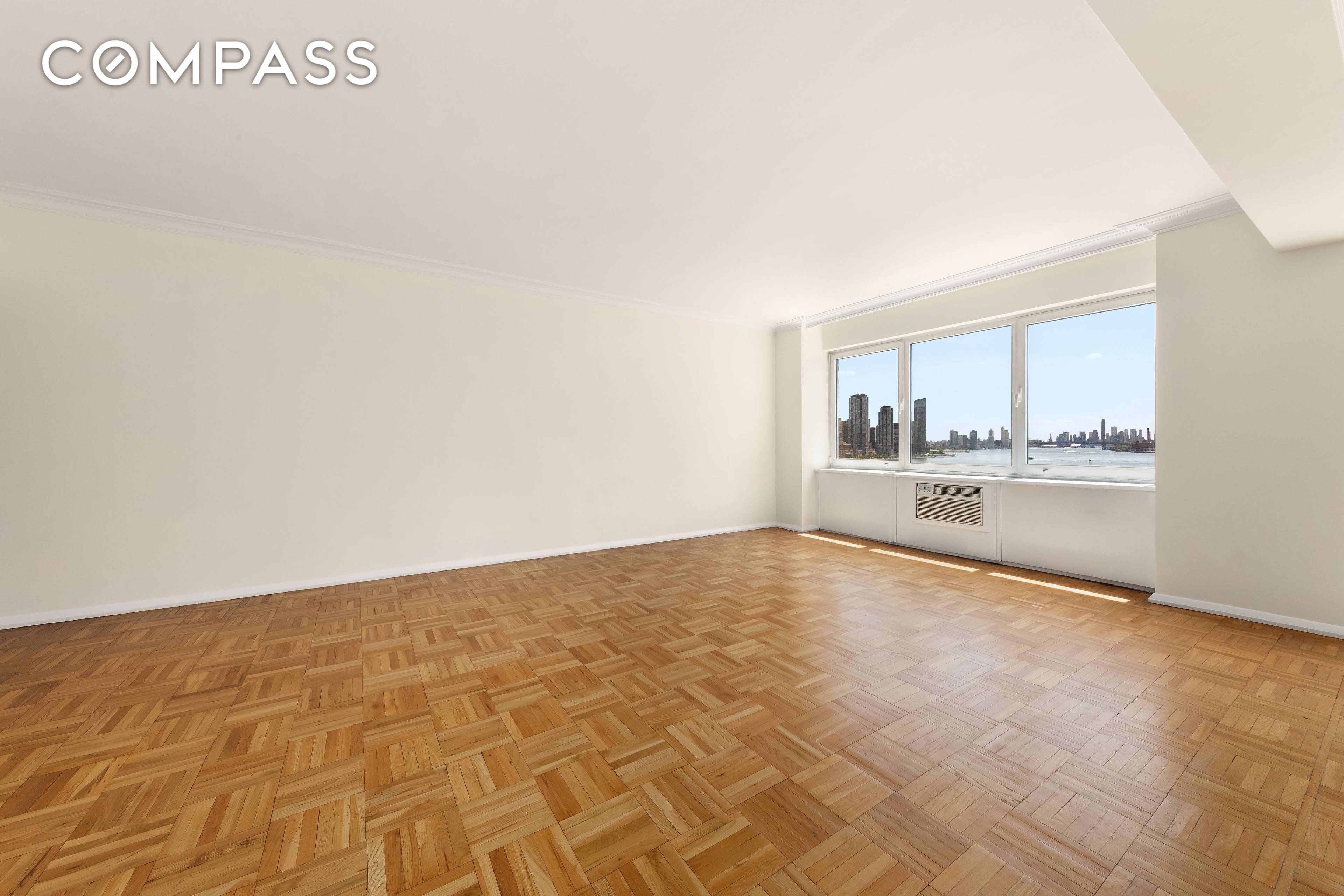 Bathed in natural light and framed by expansive high floor views of the East River and Manhattan skyline, this approximately 1, 600 square foot corner residence offers an exceptional layout ...