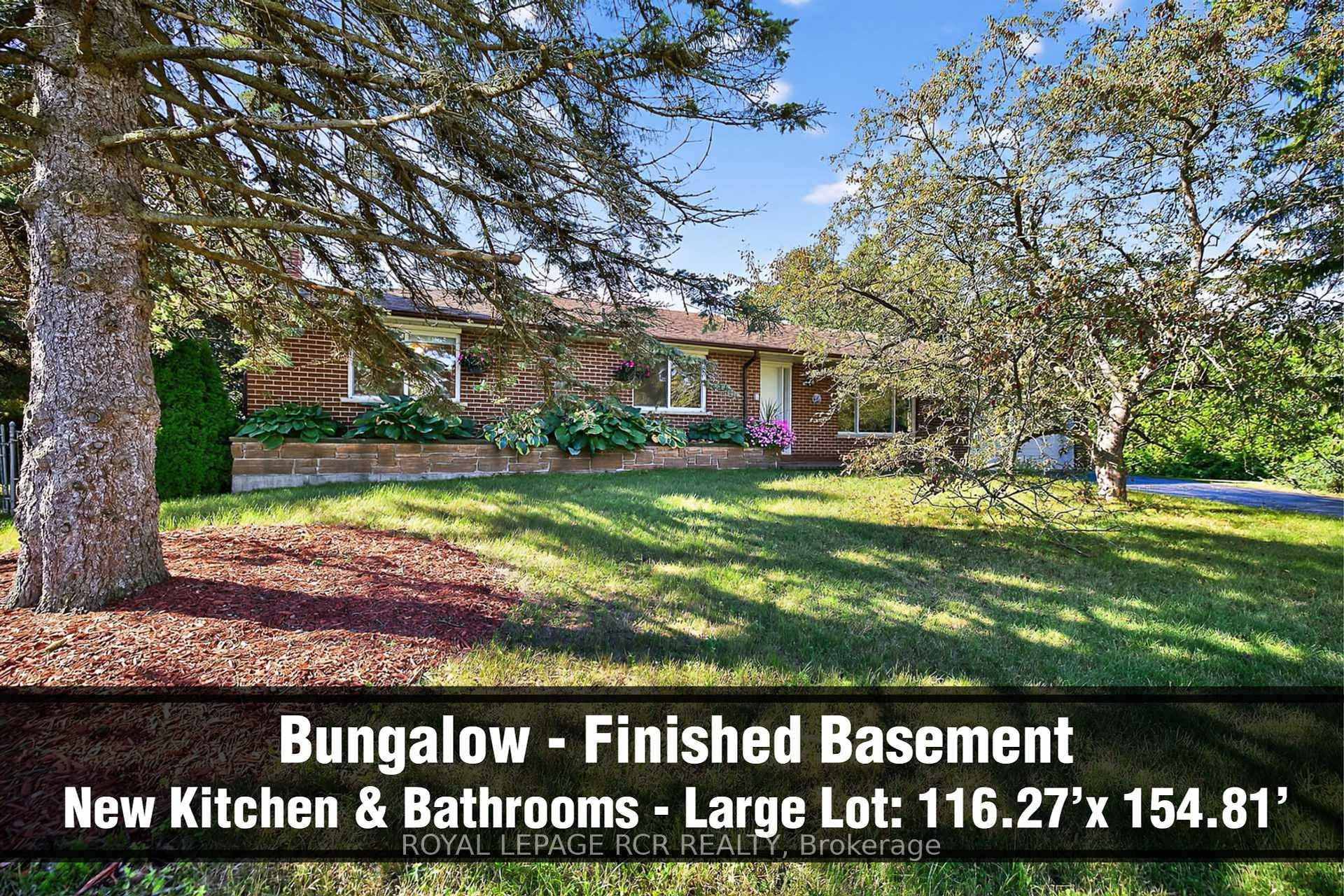 Charming and meticulous, brick Bungalow with separate entrance finished basement, two car garage and very private driveway on oversized 0.