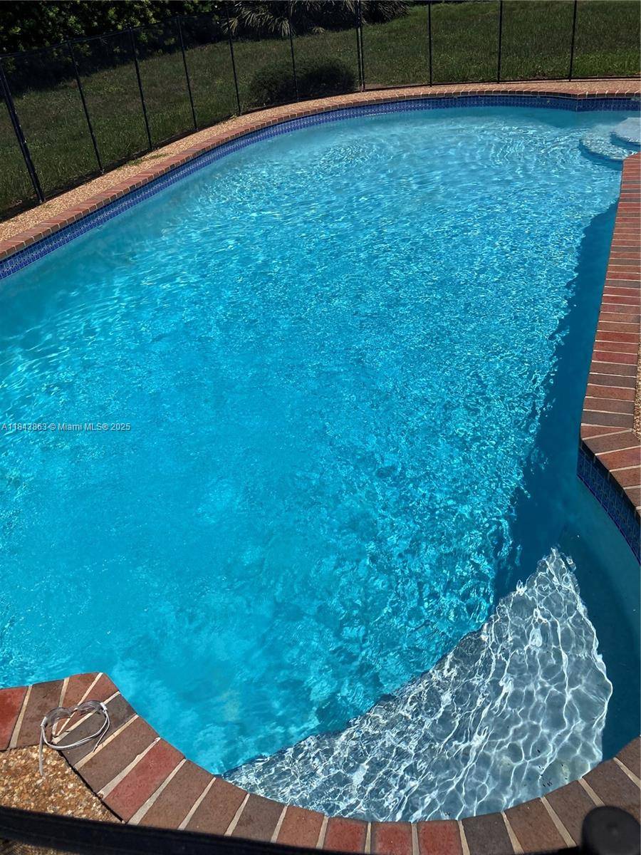 4 bed 2. 5 bath paradise with private backyard with large hedges.
