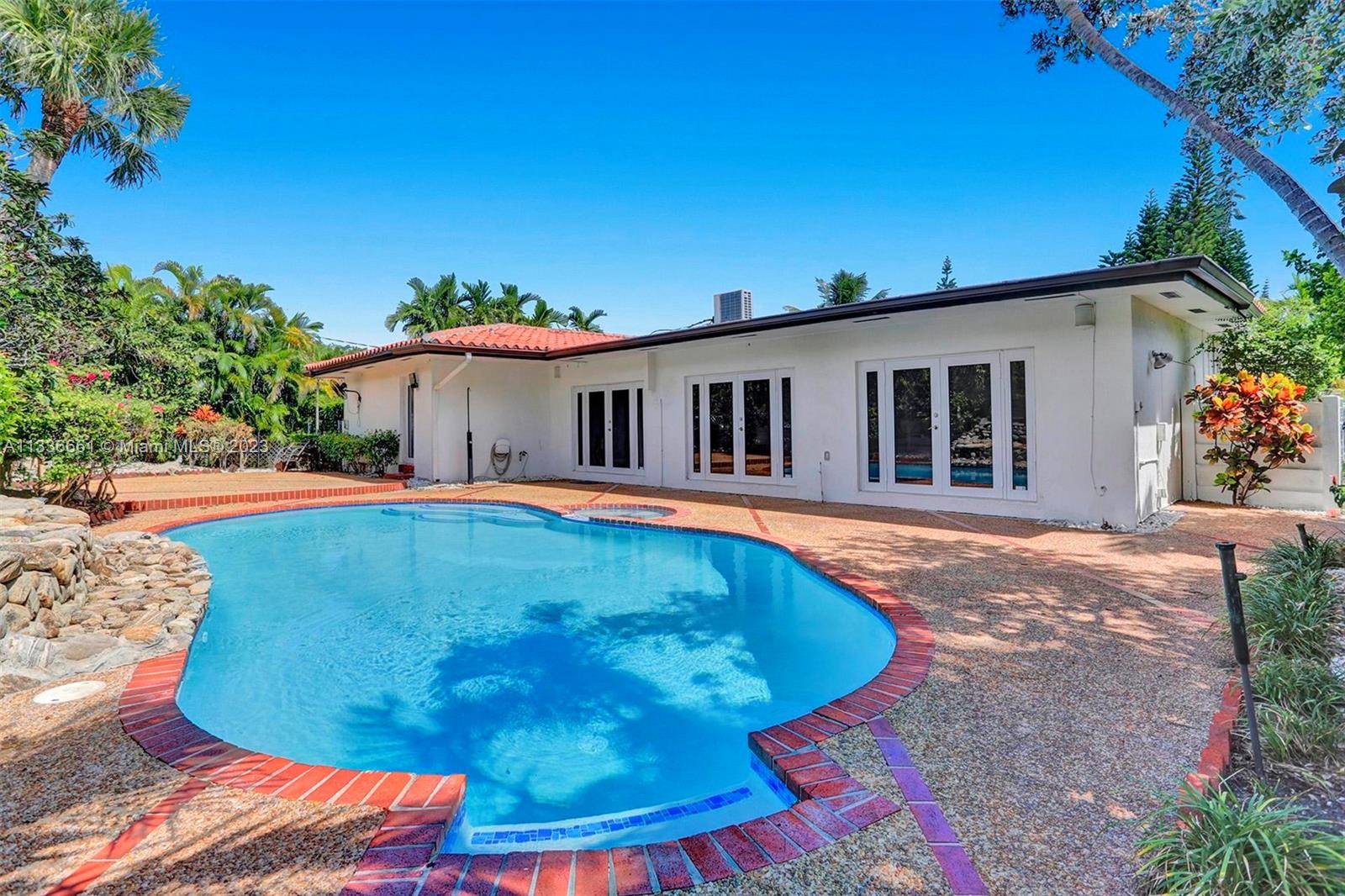 Large, modern contemporary home located in the gated community of Sans Souci Estates.